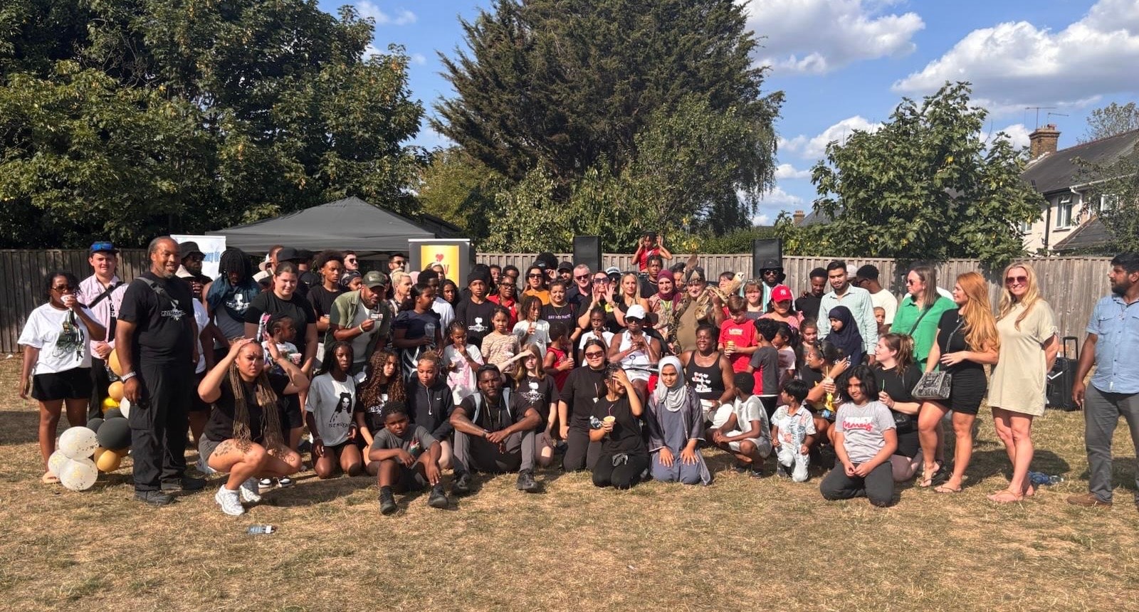 Large outdoor community gathering at a CAV event