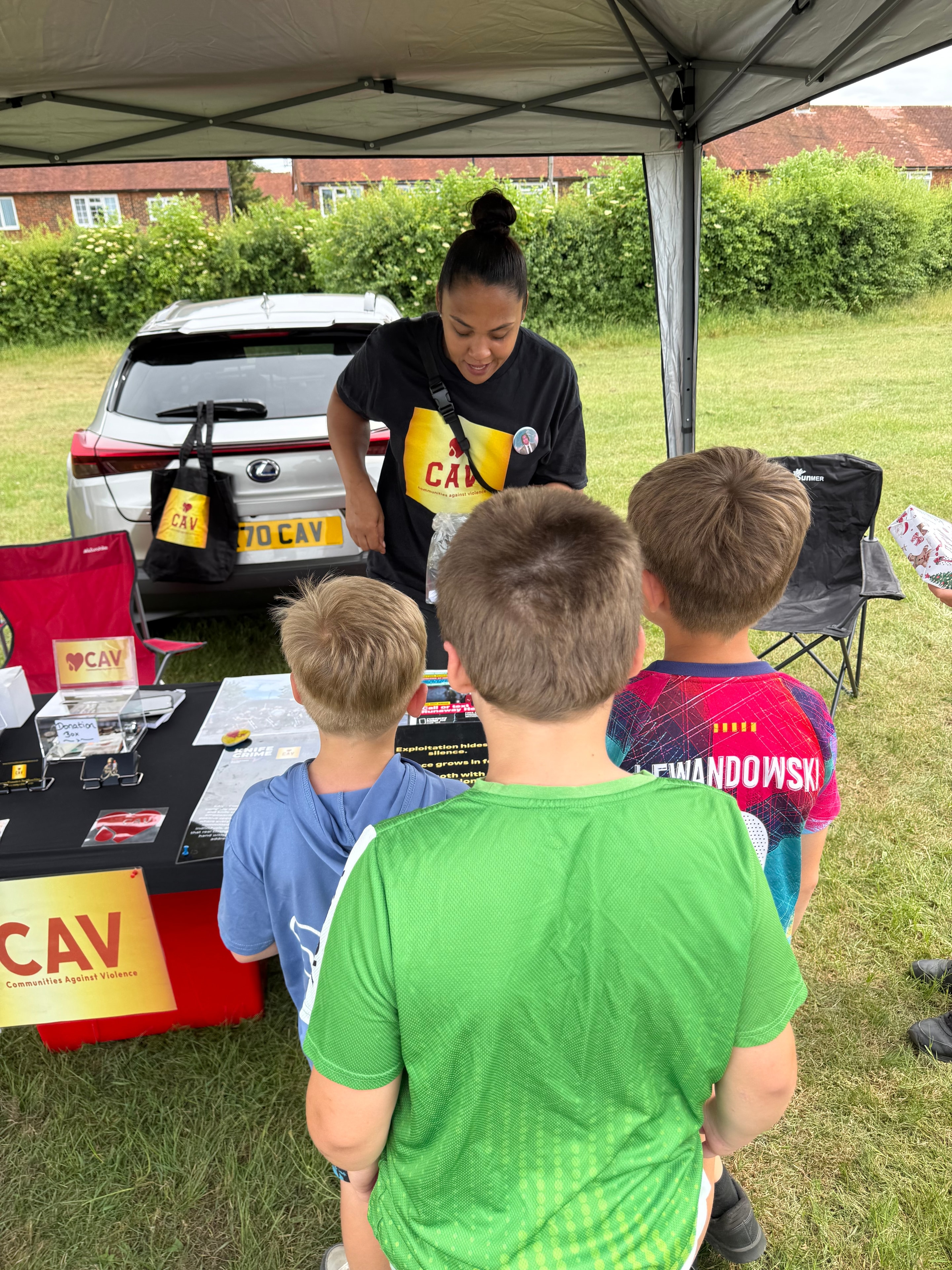 Woman engaging children at a community charity event